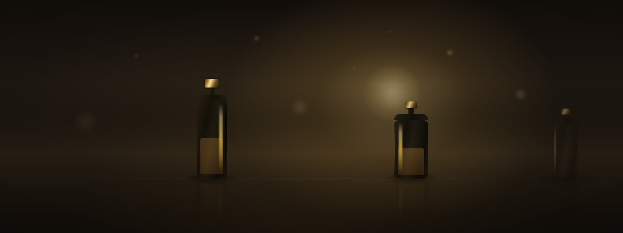 Dark, gold-lit perfume bottles in soft focus, evoking the atelier atmosphere behind every composition.
